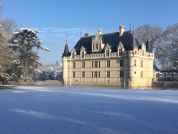 a view of Azay-le-Rideau chateau in snow