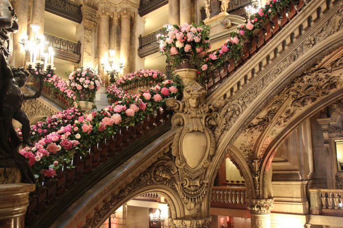 staircase at opera palais garnier, handrail lined with roses
