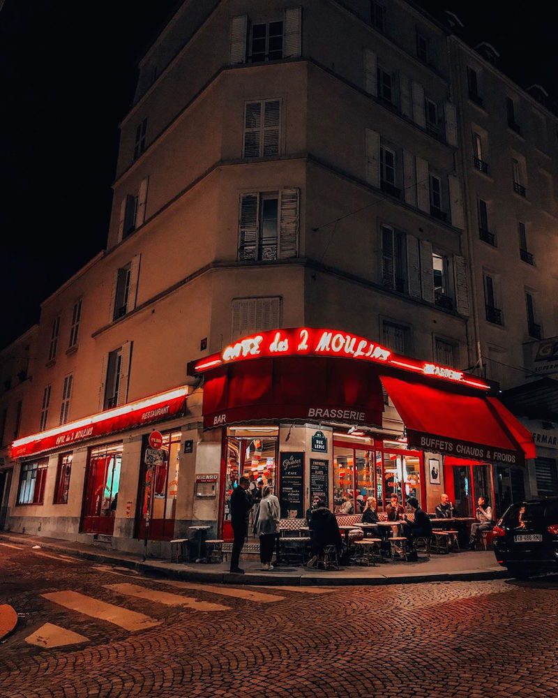 a nighttime view of cafe des 2 moulins 