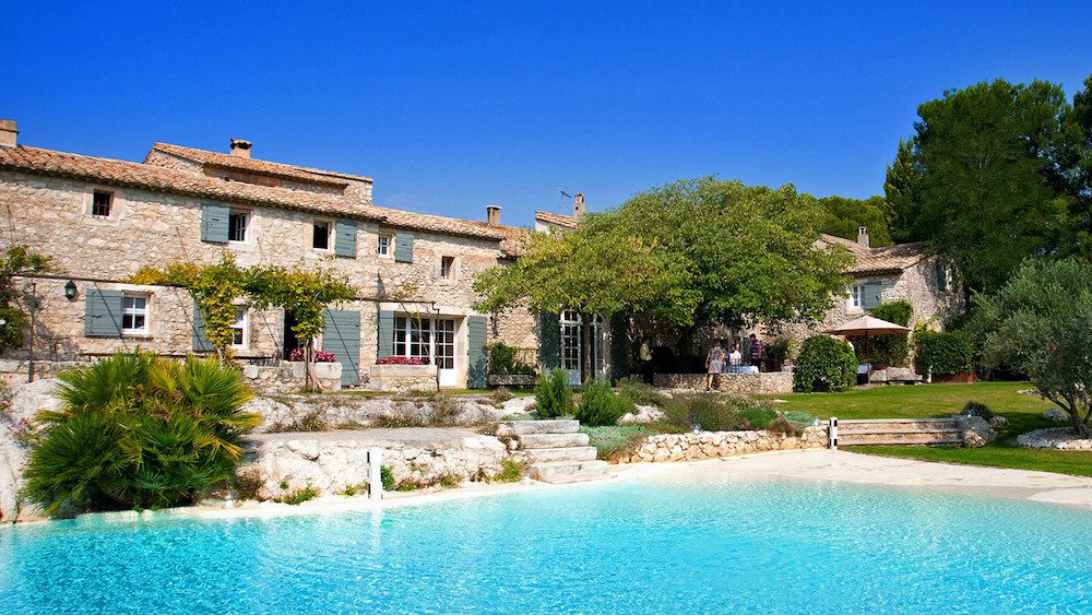 swimming pool in front of a provencal mas