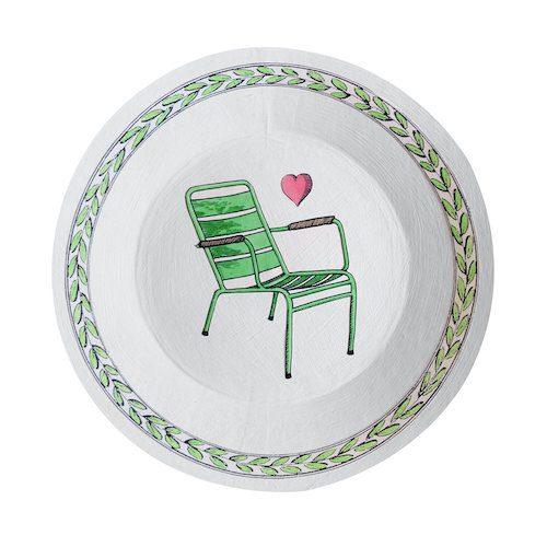 a white bowl with a green chair