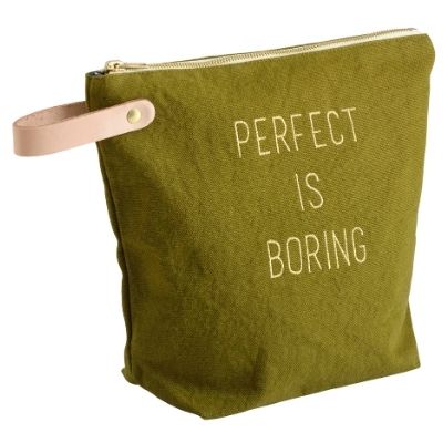 a green trousse de toilette with writing on front