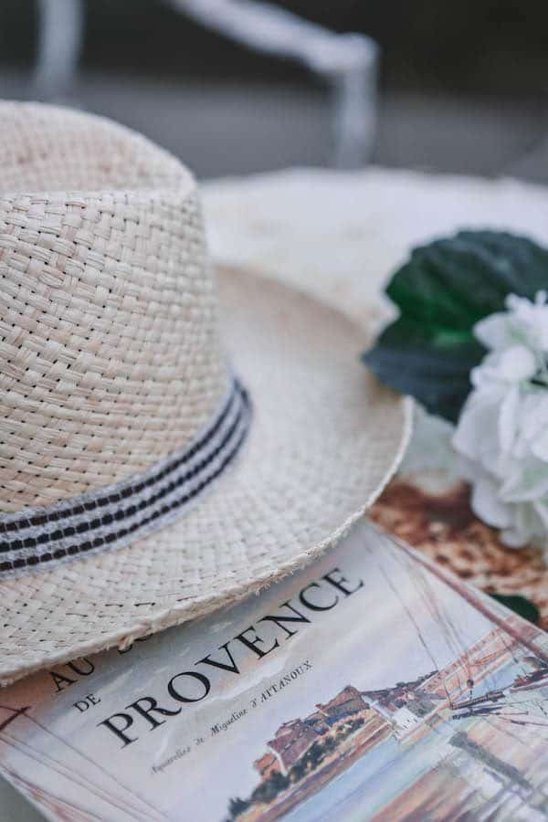 french book and hat