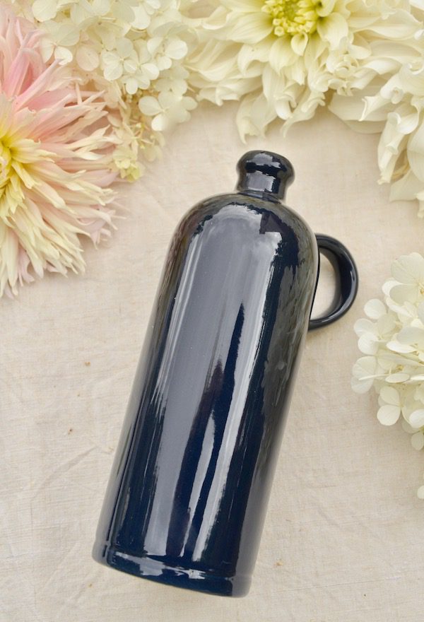 a deep blue ceramic jug