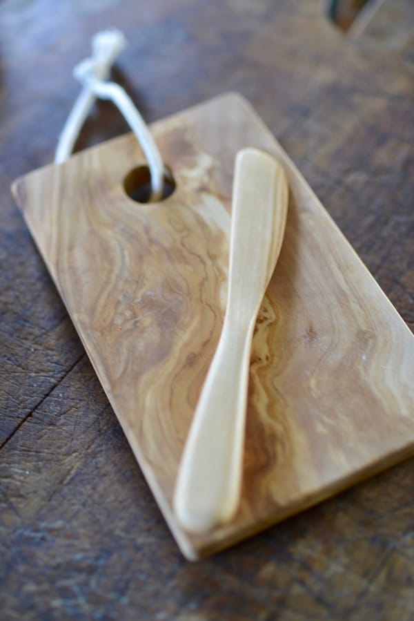 olive wood chopping board and rounded knife