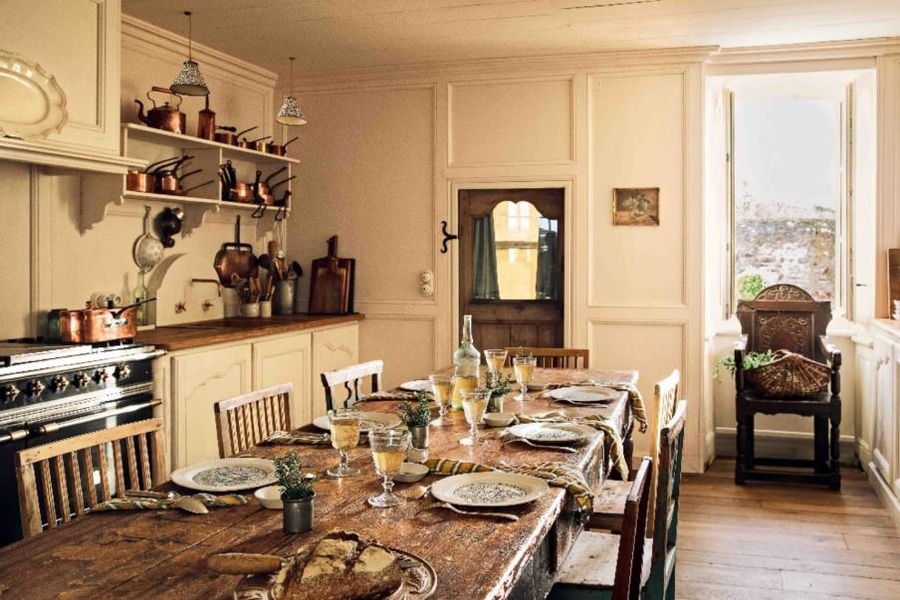 Rustic kitchen with dining table set for dinner -  French Kitchen Design Inspiration
