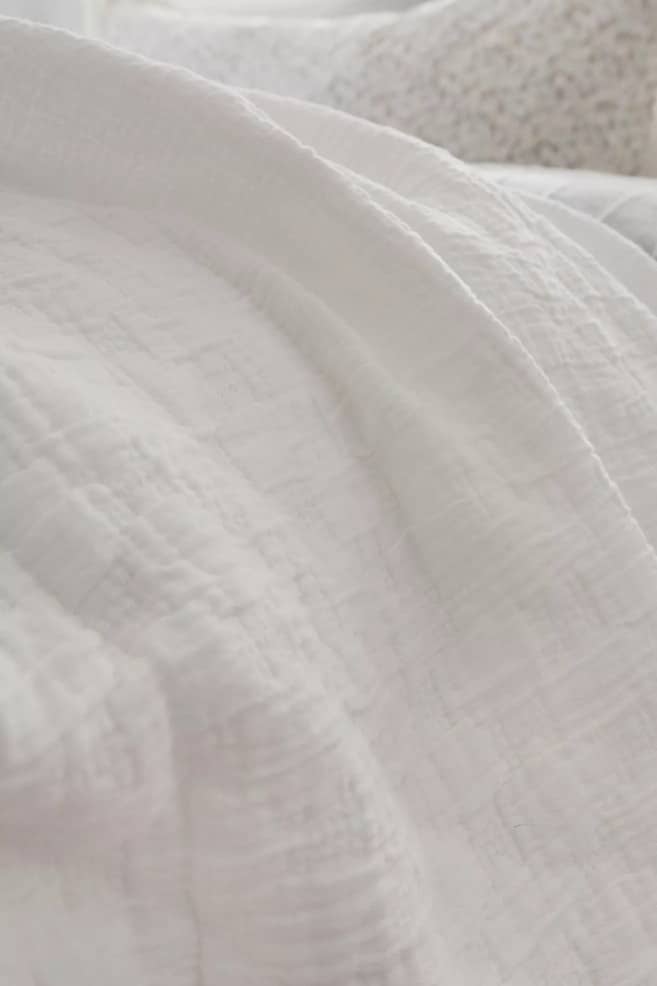 white bedding coverlet