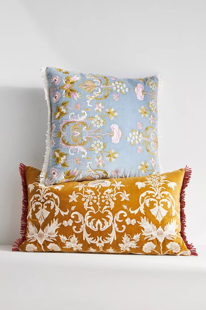 two embroidered pillows